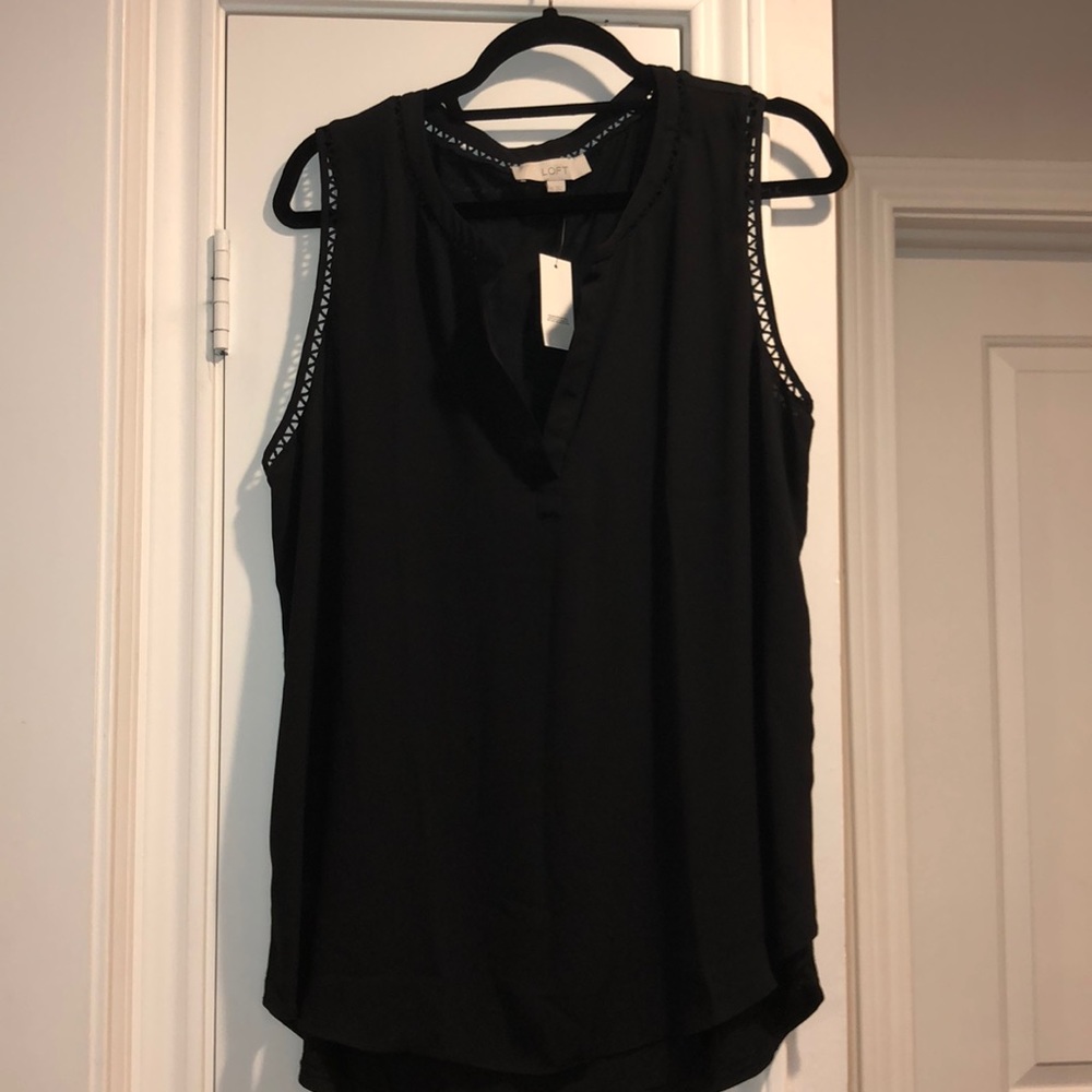 Sleeveless black top with trim